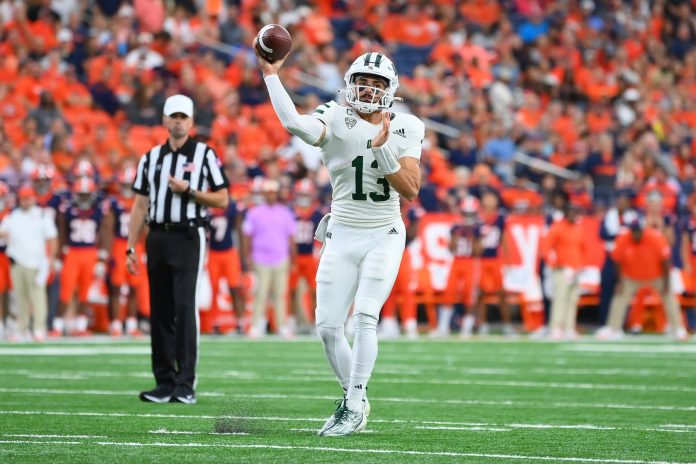 Ohio Bobcats quarterback Parker Navarro (13) passes the ball against the Syracuse Orange during the first half at the JMA Wireless Dome.