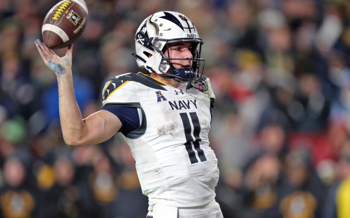 Navy Midshipmen quarterback Blake Horvath (11) celebrates his touchdown against the Army Black Knights during the second half of the the 125th Army-Navy game at Northwest Stadium.