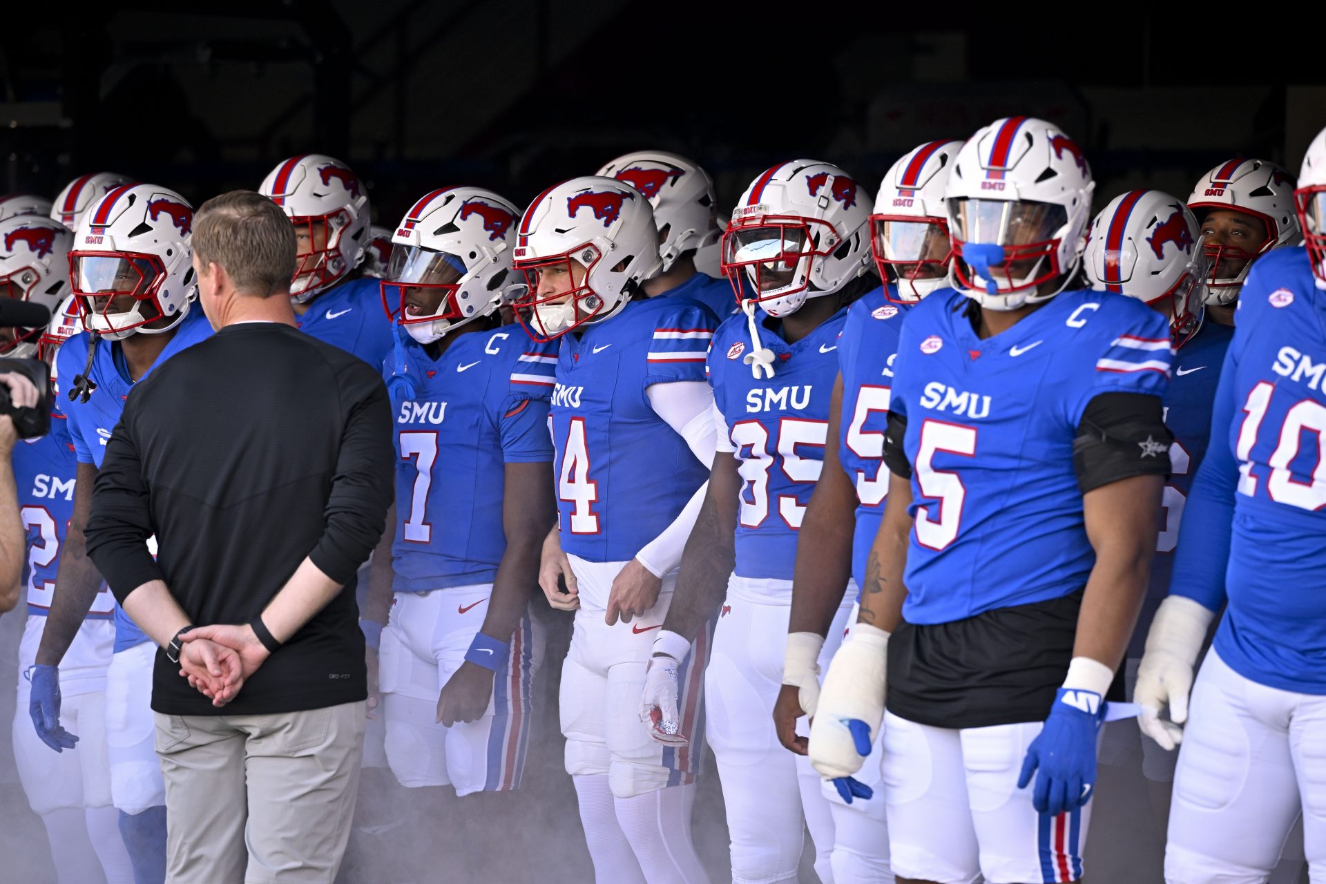 Southern Methodist Mustangs head coach Rhett Lashlee prepares to lead the Mustangs on to the field before the game between the SMU Mustangs and the California Golden Bears at Gerald J. Ford Stadium.