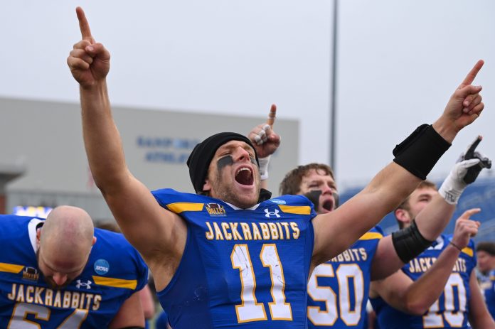 South Dakota State quarterback Mark Gronowski (11) cheers after singing the victory song on Saturday, Dec. 14, 2024, at Dana J. Dykhouse Stadium in Brookings.