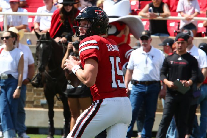 Texas Tech Red Raiders quarterback Will Hammond (15) drops back to pass against the North Texas Mean Green in the second half at Jones AT&T Stadium and Cody Campbell Field.