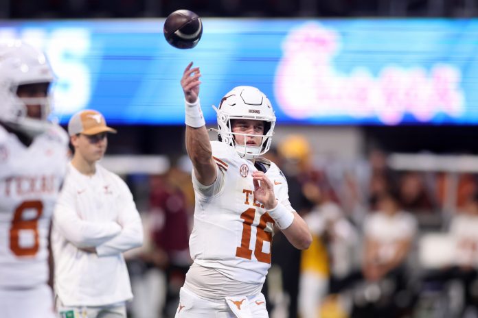 Texas Longhorns quarterback Arch Manning (16) warms up before the Peach Bowl at Mercedes-Benz Stadium.