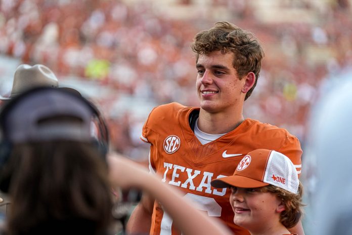 Texas Longhorns quarterback Arch Manning (16) takes a photo with fans after the 35-13 win over Mississippi State at Darrell K Royal-Texas Memorial Stadium in Austin Saturday, Sept. 28, 2024.