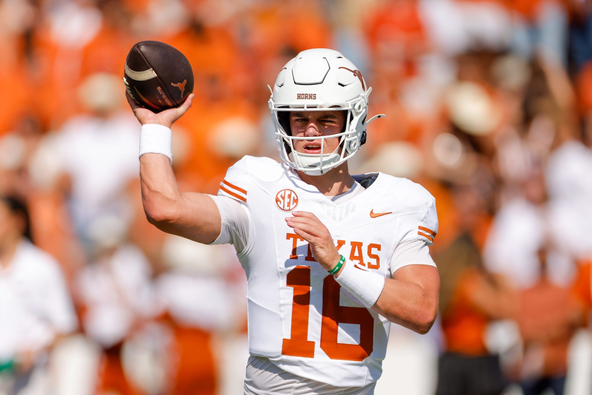 Texas Longhorns quarterback Arch Manning (16) warms up prior to the game against the Oklahoma Sooners at the Cotton Bowl.