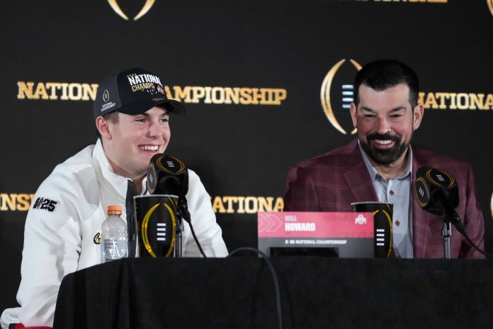 Ohio State Buckeyes quarterback Will Howard (left) and Ohio State Buckeyes head coach Ryan Day during CFP National Championship Champions press conference at The Westin Peachtree Plaza, Savannah Ballroom.