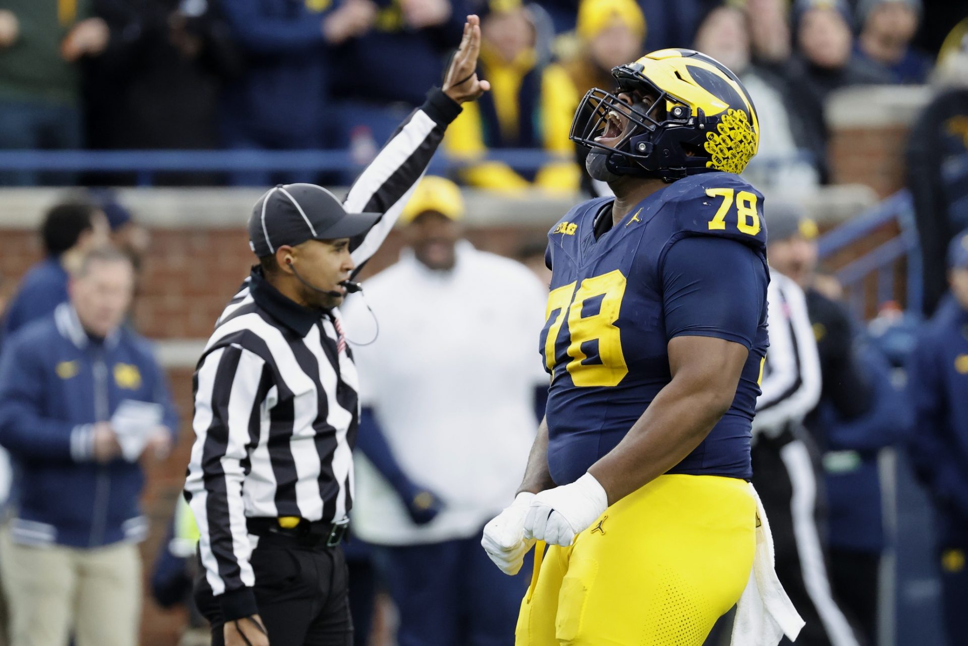 Michigan Wolverines defensive lineman Kenneth Grant (78) celebrates after sacking Northwestern Wildcats quarterback Jack Lausch (not pictured) in the first half at Michigan Stadium.