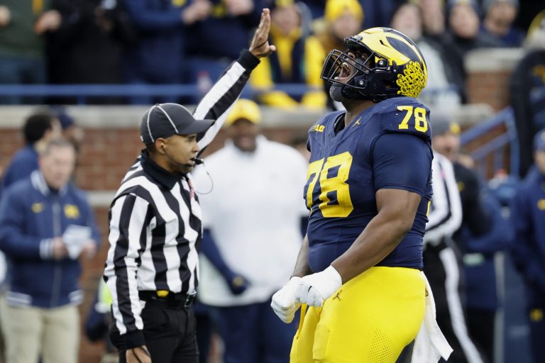 Michigan Wolverines defensive lineman Kenneth Grant (78) celebrates after sacking Northwestern Wildcats quarterback Jack Lausch (not pictured) in the first half at Michigan Stadium.