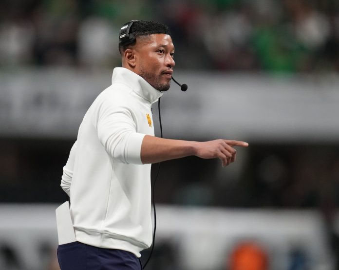 Notre Dame Fighting Irish head coach Marcus Freeman reacts against the Ohio State Buckeyes in the second half in the CFP National Championship college football game at Mercedes-Benz Stadium.