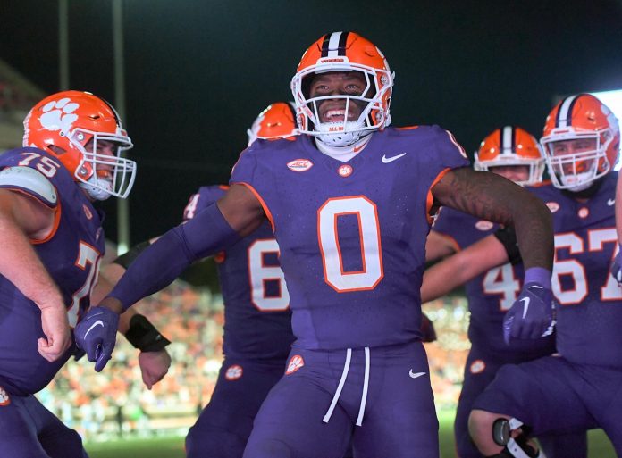 Clemson Tigers linebacker Barrett Carter (0) celebrates after scoring a touchdown against The Citadel Bulldogs during the fourth quarter at Memorial Stadium.