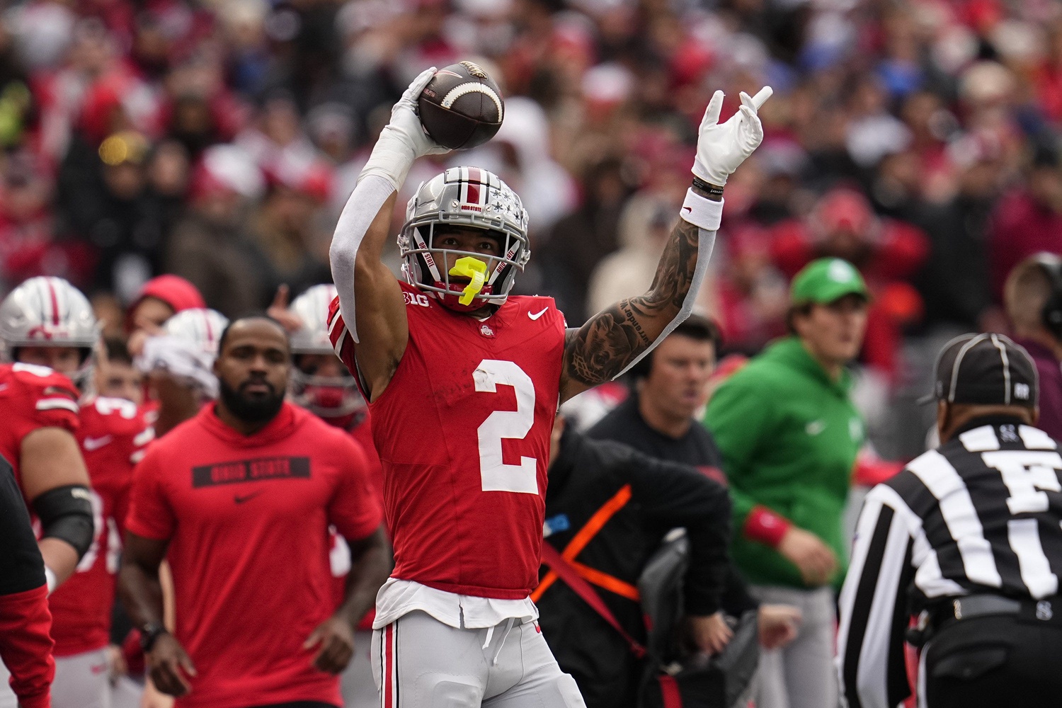 Ohio State Buckeyes wide receiver Emeka Egbuka (2) celebrates a first down catch during the second half of the NCAA football game against the Indiana Hoosiers at Ohio Stadium in Columbus on Saturday, Nov. 23, 2024. Ohio State won 38-15.