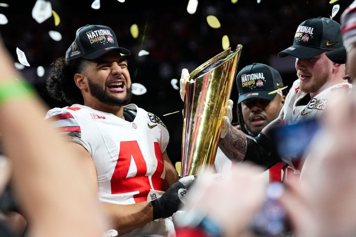 Ohio State Buckeyes defensive end JT Tuimoloau (44) celebrates after defeating Notre Dame Fighting Irish in the College Football Playoff championship game at Mercedes-Benz Stadium in Atlanta on Jan. 21, 2025.