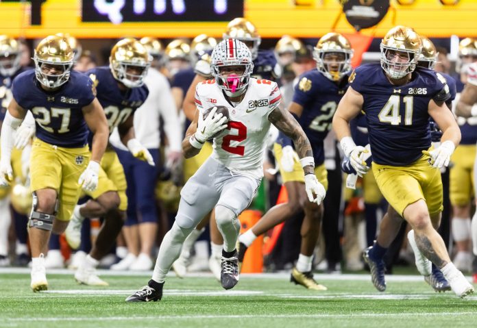 Ohio State Buckeyes wide receiver Emeka Egbuka (2) against the Notre Dame Fighting Irish during the CFP National Championship college football game at Mercedes-Benz Stadium.