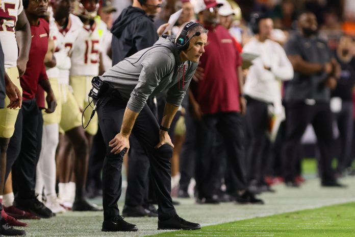 Florida State Seminoles head coach Mike Norvell watches from the sideline against the Miami Hurricanes during the second quarter at Hard Rock Stadium.