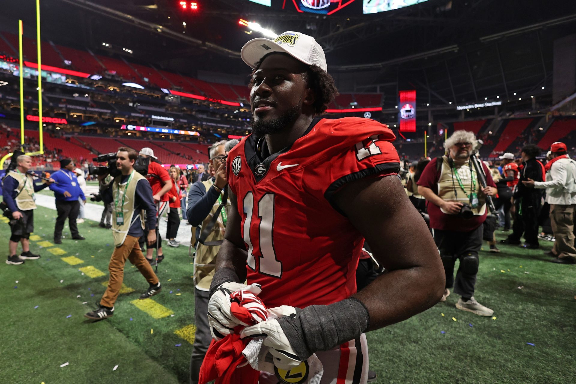 Georgia Bulldogs linebacker Jalon Walker (11) reacts after defeating the Texas Longhorns in overtime in the 2024 SEC Championship game at Mercedes-Benz Stadium.