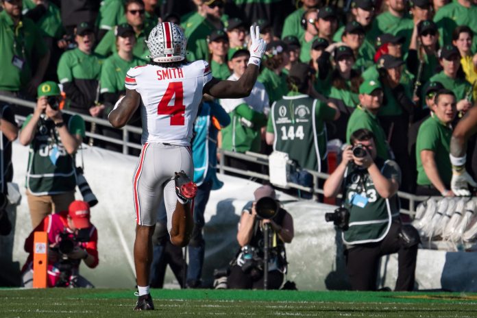 Ohio State wide receiver Jeremiah Smith takes off for a touchdown as the Oregon Ducks face the Ohio State Buckeyes Wednesday, Jan. 1, 2025, in the quarterfinal of the College Football Playoff at the Rose Bowl in Pasadena, Calif.