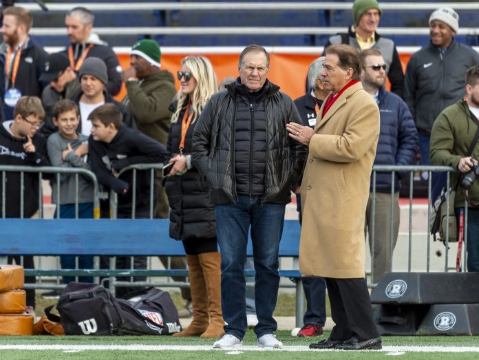 Alabama head coach Nick Saban at right talks with New England Patriots head coach Bill Belichick during Senior Bowl practice at Ladd-Peebles Stadium.