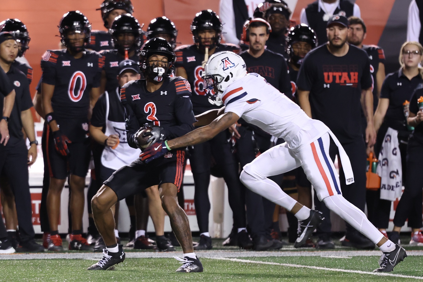 Utah Utes wide receiver Dorian Singer (3) is tackled by Utah Utes cornerback Kenan Johnson (1) during the second quarter at Rice-Eccles Stadium.