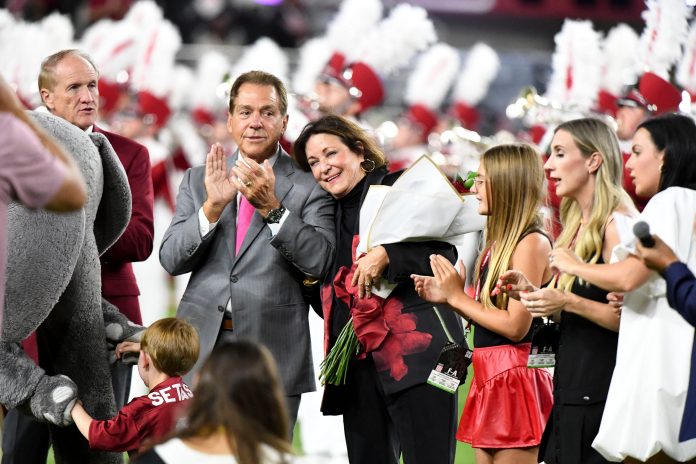 Nick Saban and family are honored a half time with the renaming of the playing surface as Nick Saban Filed at Bryant-Denny Stadium. Terry Saban puts her head on Nick Saban’s shoulder during the ceremony.