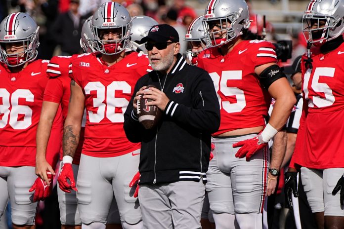 Ohio State Buckeyes defensive coordinator Jim Knowles leads warm ups prior to the NCAA football game against the Nebraska Cornhuskers at Ohio Stadium in Columbus on Saturday, Oct. 26, 2024.