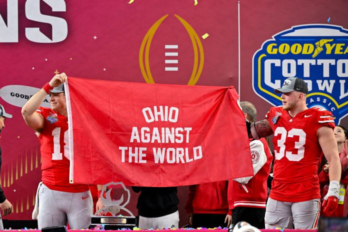 Ohio State Buckeyes quarterback Will Howard (18) and defensive end Jack Sawyer (33) celebrate after the game between the Texas Longhorns and the Ohio State Buckeyes at AT&T Stadium.