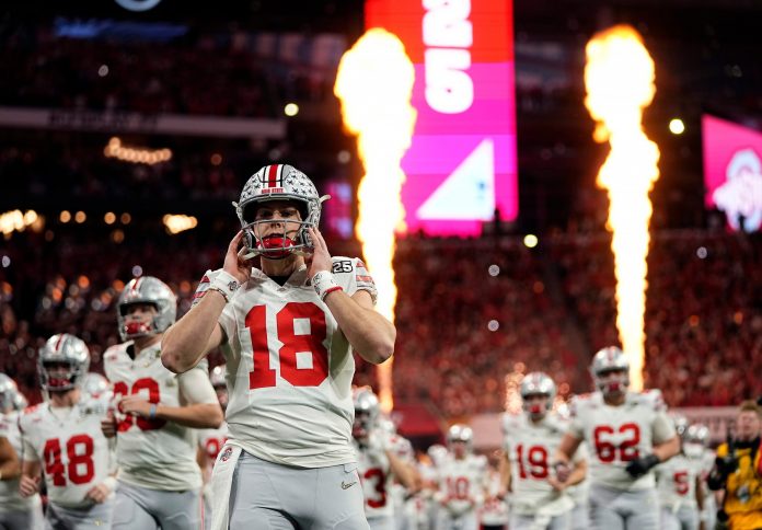 Ohio State Buckeyes quarterback Will Howard (18) take the field for the start of the game against Notre Dame Fighting Irish during the College Football Playoff National Championship at Mercedes-Benz Stadium in Atlanta on January 20, 2025.