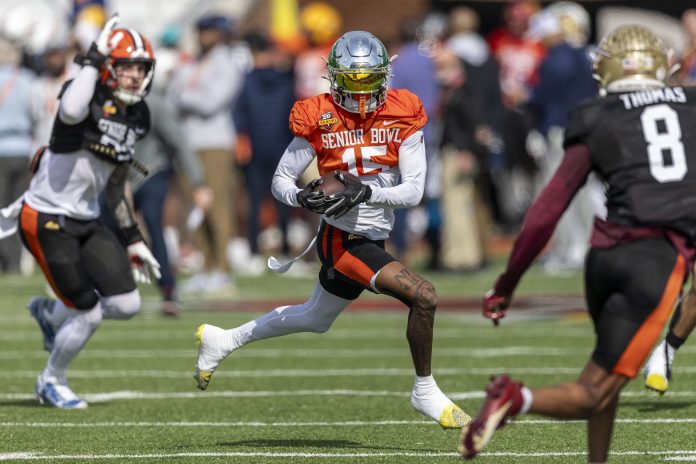 National team wide receiver Tez Johnson of Oregon (15) runs the ball after a catch during Senior Bowl practice for the National team at Hancock Whitney Stadium.