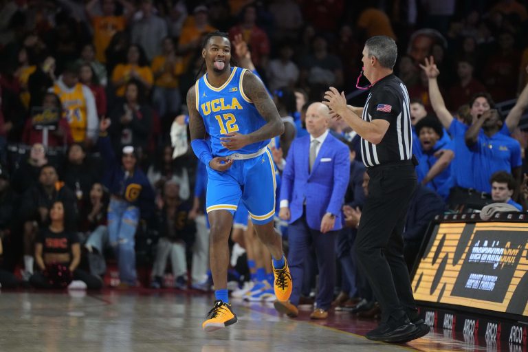 UCLA Bruins guard Sebastian Mack (12) celebrates after a three-point basket against the Southern California Trojans in the second half at the Galen Center.