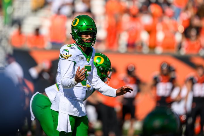 Oregon Ducks quarterback Dante Moore (5) calls a play during the second half against the Oregon State Beavers at Reser Stadium.