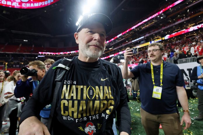 Ohio State Buckeyes defensive coordinator Jim Knowles celebrates after winning against the Notre Dame Fighting Irish in the CFP National Championship college football game at Mercedes-Benz Stadium.