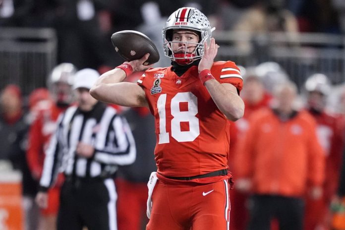 Ohio State quarterback Will Howard (18) pulls back for the throw during the NCAA college football playoff game against Tennessee on Saturday, Dec. 21, 2024, in Columbus, Ohio.