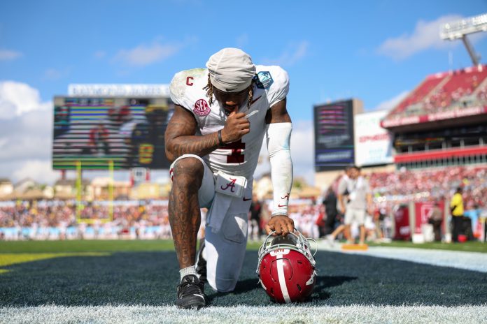 Alabama Crimson Tide quarterback Jalen Milroe (4) gets ready to play the third quarter against the Michigan Wolverines during the ReliaQuest Bowl at Raymond James Stadium.