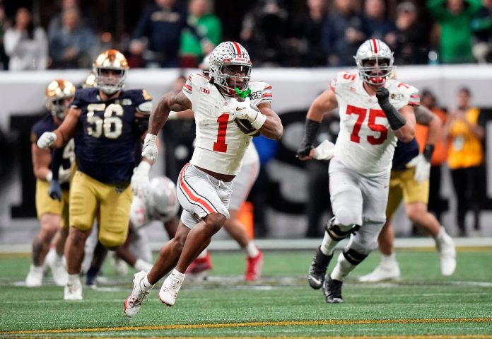 Ohio State Buckeyes running back Quinshon Judkins (1) gets away from the Notre Dame Fighting Irish defense for a long run in the third quarter during the College Football Playoff championship at Mercedes-Benz Stadium in Atlanta on January 20, 2025.