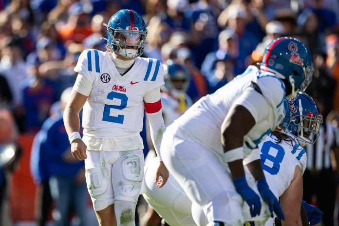 Mississippi Rebels quarterback Jaxson Dart (2) calls a play against the Florida Gators during the second half at Ben Hill Griffin Stadium.