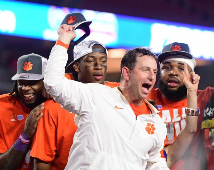 Clemson Tigers head coach Dabo Swinney celebrates during the trophy presentation for the Fiesta Bowl during the 2016 CFP semifinal against the Ohio State Buckeyes at University of Phoenix Stadium. The Clemson Tigers won 31-0.