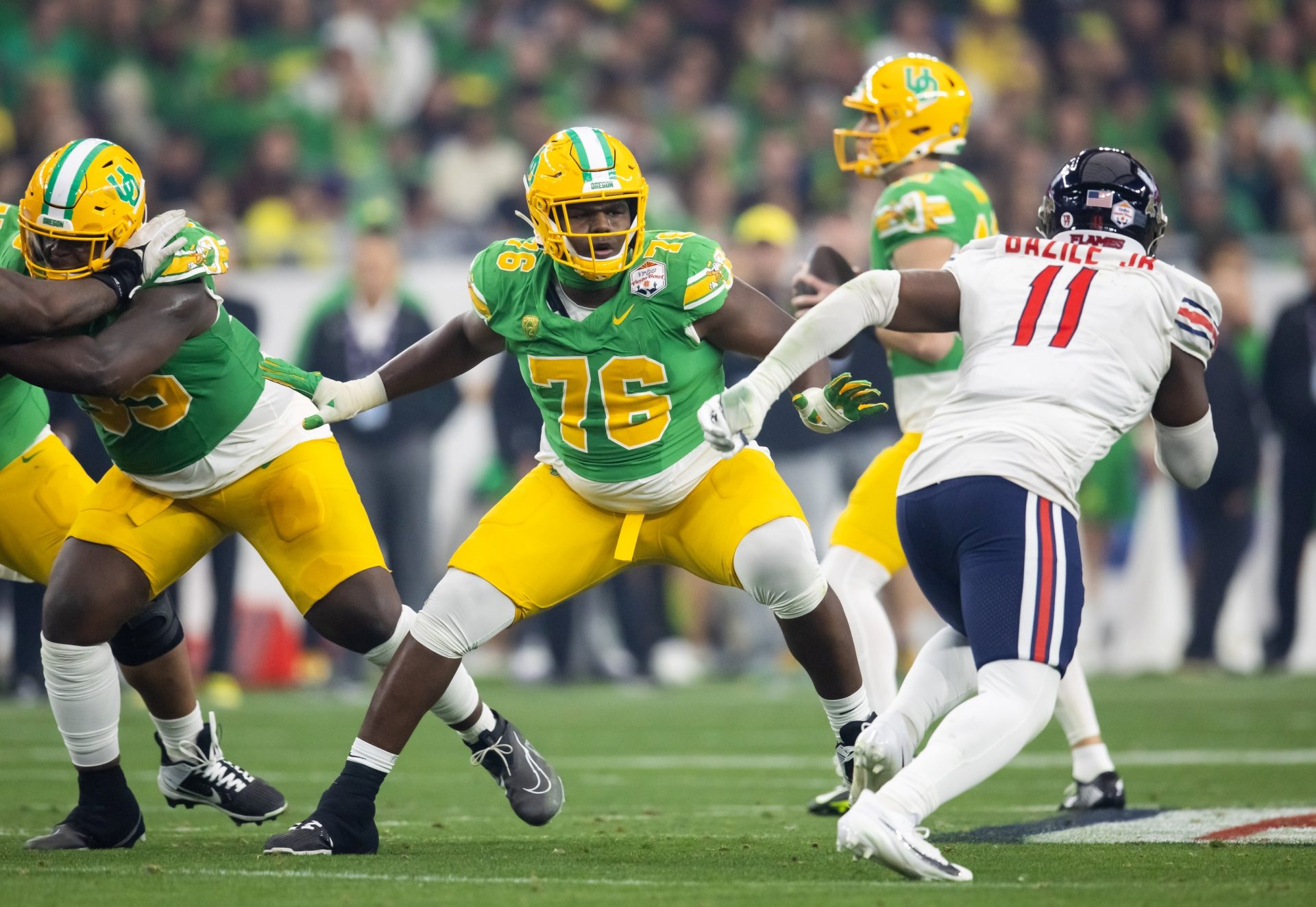 Oregon Ducks offensive lineman Josh Conerly Jr. (76) against the Liberty Flames during the 2024 Fiesta Bowl at State Farm Stadium.