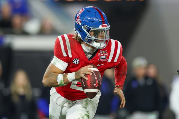 Mississippi Rebels quarterback Jaxson Dart (2) drops back to pass against the Duke Blue Devils in the second quarter during the Gator Bowl at EverBank Stadium.