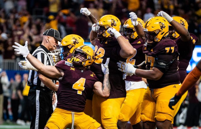 Arizona State celebrate together after Arizona State Sun Devils running back Cam Skattebo (4) scores a touchdown in the fourth quarter as the Texas Longhorns play the Arizona State Sun Devils in the Peach Bowl College Football Playoff quarterfinal at Mercedes-Benz Stadium in Atlanta, Georgia, Jan. 1, 2025.