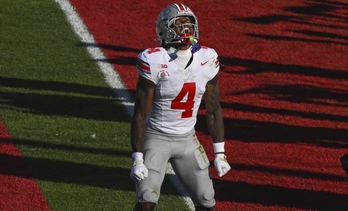 Ohio State Buckeyes wide receiver Jeremiah Smith (4) celebrates scoring a touchdown in the second quarter against the Oregon Ducks at Rose Bowl Stadium.