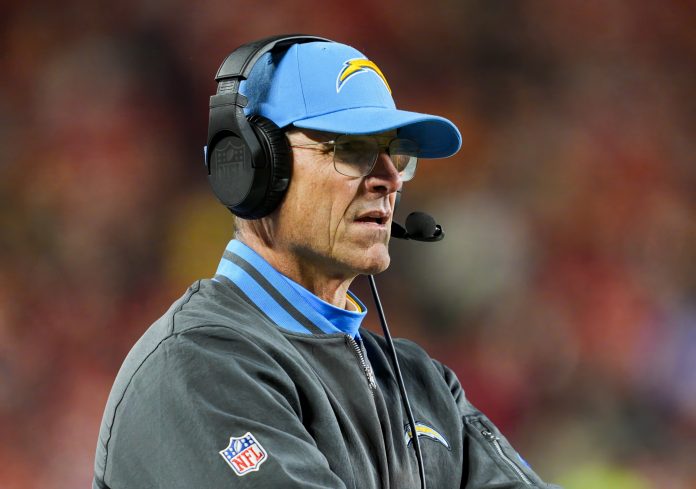 Los Angeles Chargers head coach Jim Harbaugh watches from the sideline during the first half against the Kansas City Chiefs at GEHA Field at Arrowhead Stadium.