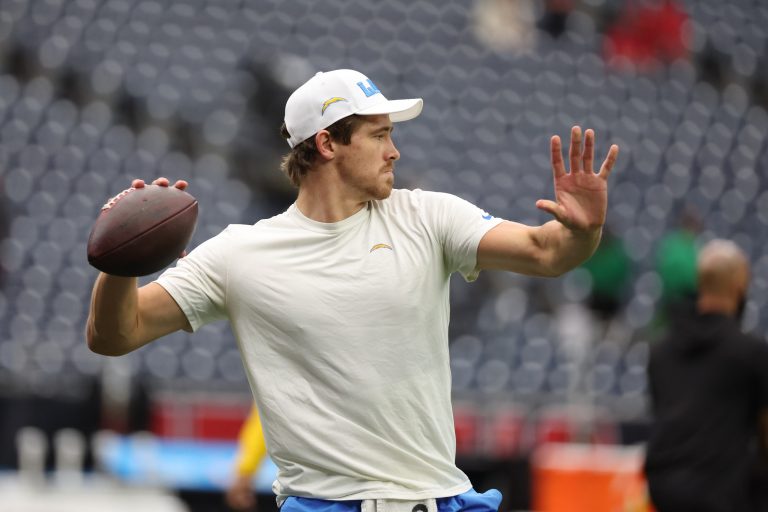 Los Angeles Chargers quarterback Justin Herbert (10) warms up before playing against the Houston Texans in an AFC wild card game at NRG Stadium.