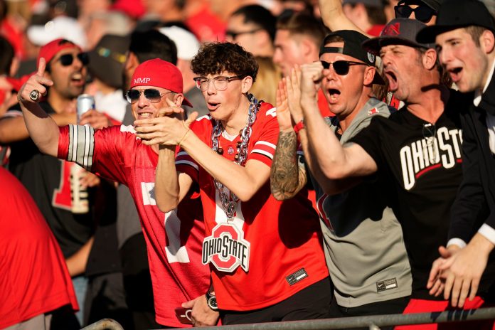 Ohio State Buckeyes fans celebrate during the first half of the College Football Playoff quarterfinal against the Oregon Ducks at the Rose Bowl in Pasadena, Calif. on Jan. 1, 2025.