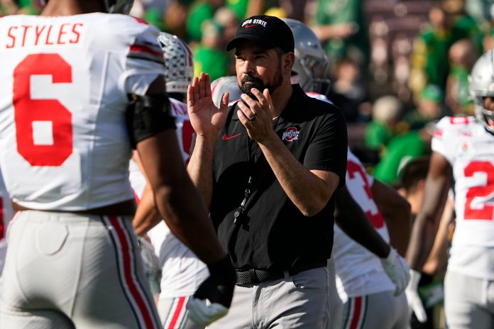 Ohio State Buckeyes head coach Ryan Day leads warm ups prior to the College Football Playoff quarterfinal against the Oregon Ducks at the Rose Bowl in Pasadena, Calif. on Jan. 1, 2025.