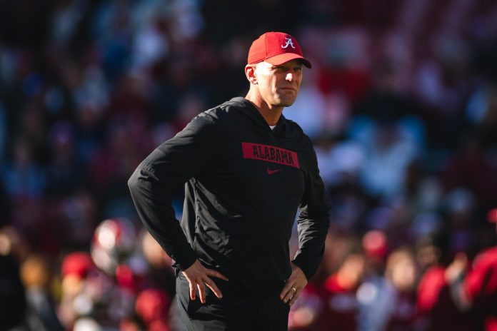 Alabama Crimson Tide head coach Kalen DeBoer walks onto the field before a game against the Auburn Tigers at Bryant-Denny Stadium.