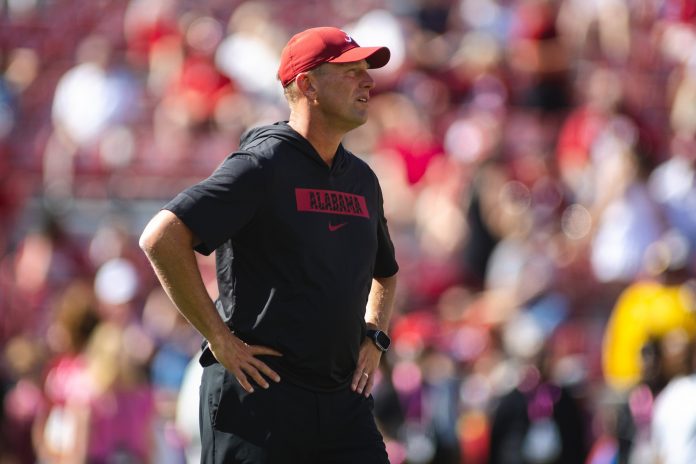 Alabama Crimson Tide head coach Kalen DeBoer walks along the field during warmups before a game against the Missouri Tigers at Bryant-Denny Stadium.