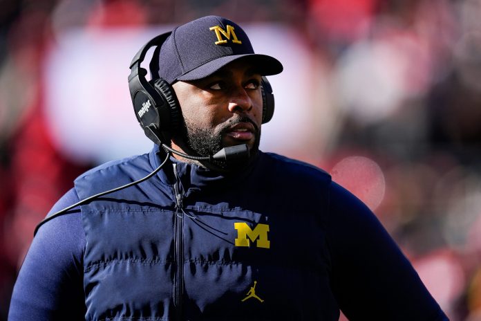 Michigan head coach Sherrone Moore looks on at a timeout against Ohio State during the first half at Ohio Stadium in Columbus, Ohio on Saturday, Nov. 30, 2024.