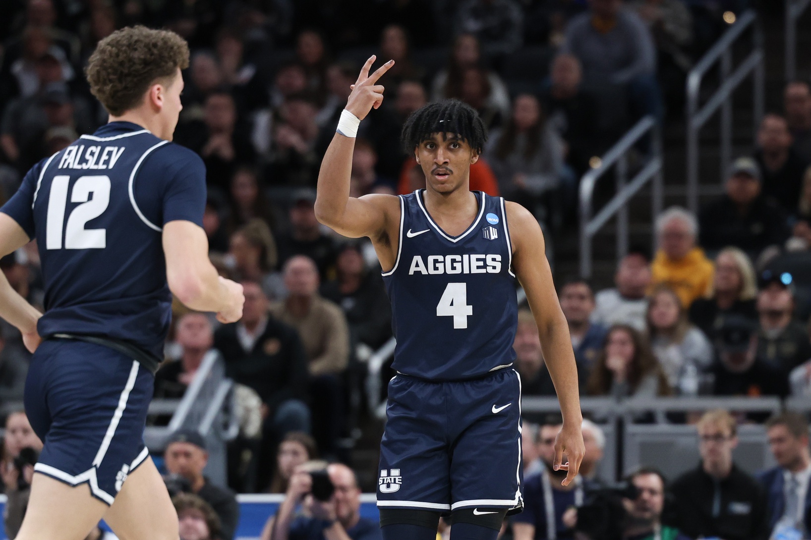 Utah State Aggies guard Ian Martinez (4) gestures after scoring against the Purdue Boilermakers during the first half at Gainbridge FieldHouse.