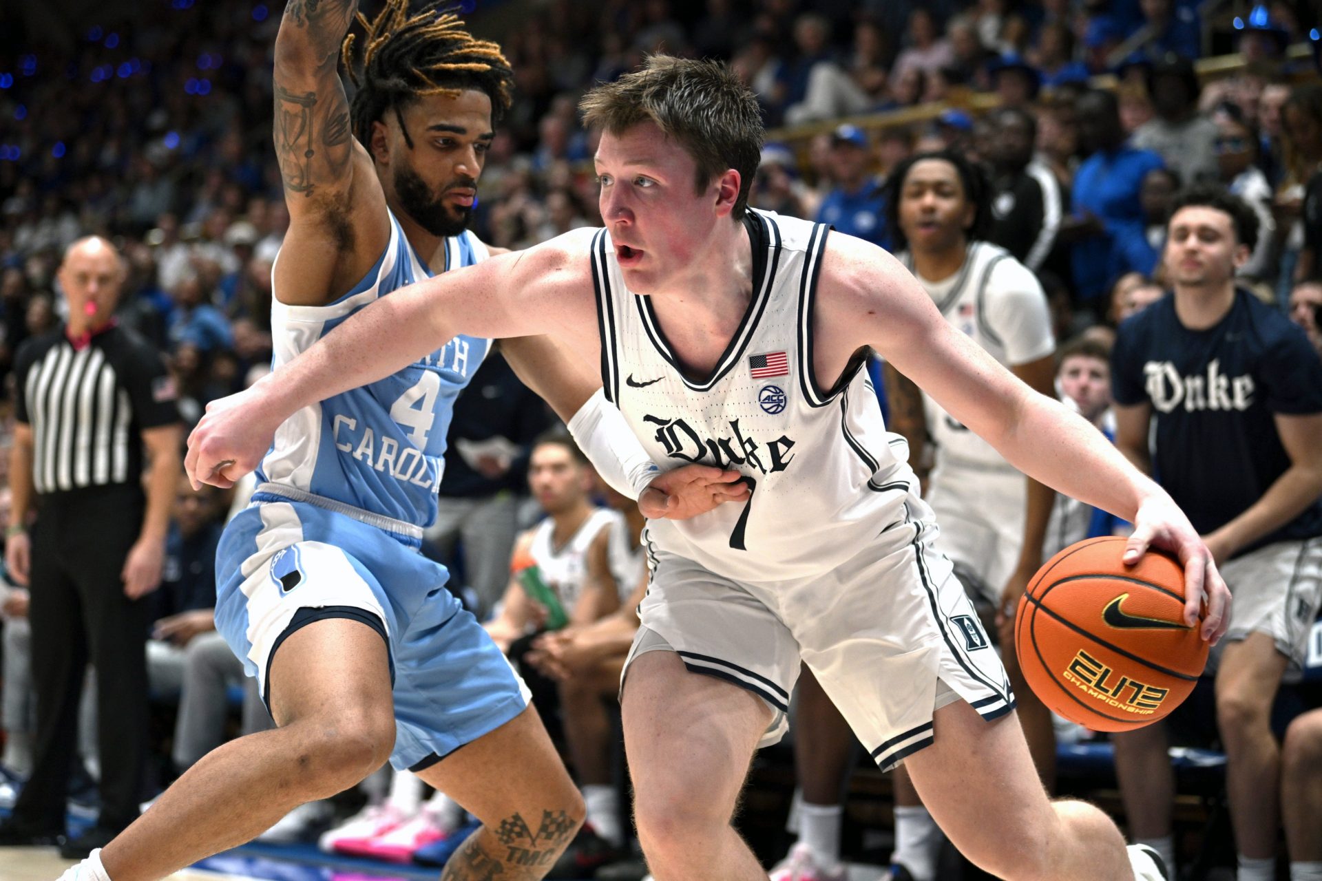 Duke Blue Devils forward Kon Knueppel (7) drives the ball around North Carolina Tar Heels guard R.J. Davis (4) during the second half at Cameron Indoor Stadium.