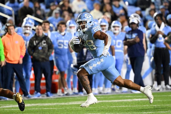 North Carolina Tar Heels running back Omarion Hampton (28) runs in the second quarter at Kenan Memorial Stadium.