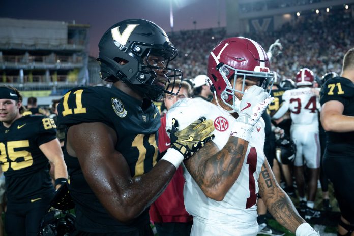 Vanderbilt Commodores wide receiver Loic Fouonji (11) talks with Alabama Crimson Tide defensive back Domani Jackson (1) after knocking off the Alabama Crimson Tide 40-35 at Vanderbilt Stadium in Nashville, Tenn., Saturday, Oct. 5, 2024.