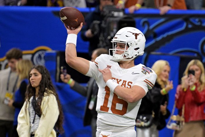 Texas Longhorns quarterback Arch Manning (16) warms ups before playing against the Washington Huskies in the 2024 Sugar Bowl college football playoff semifinal game at Caesars Superdome.